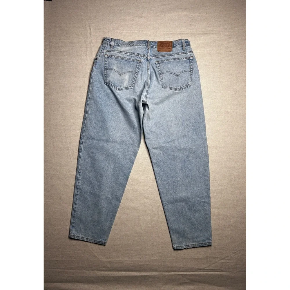 Vintage Levi's 560 Jeans Men's 38x30 Loose Fit Tapered Leg Light Wash USA